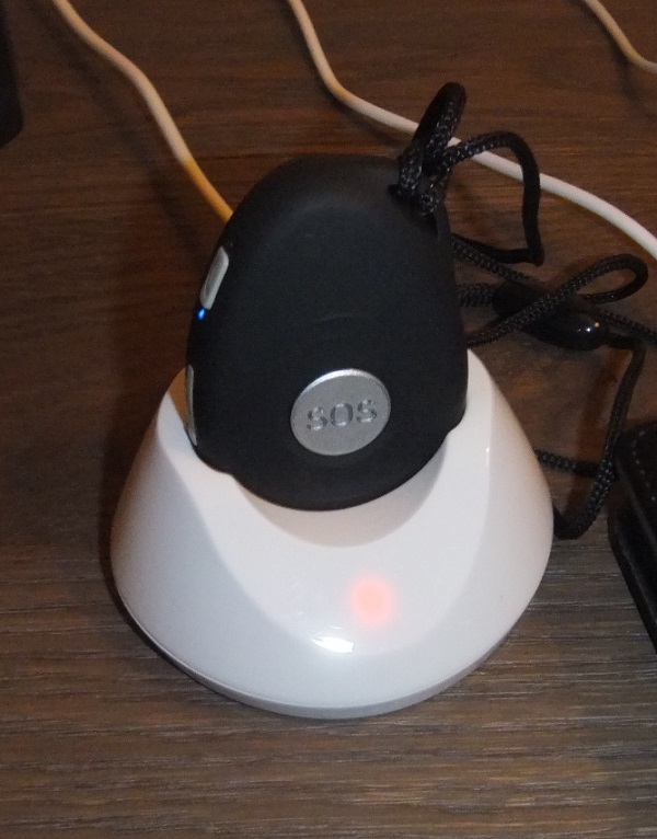 Smart-phone with emergency alarm button inside provided to residents