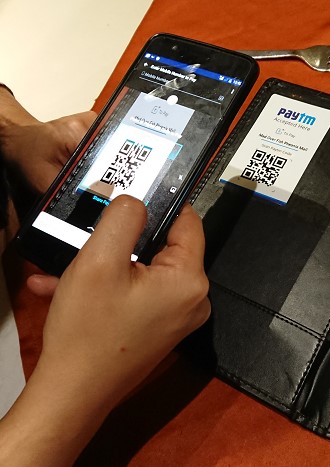 Banking transaction is completed by reading QR code by Paytm application