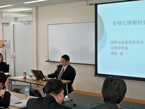 Mr. Harada presenting his report
