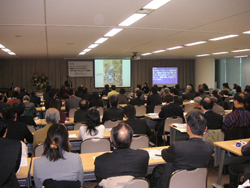 Participants fill the conference room